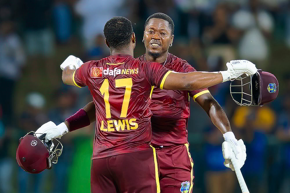 | Photo: AP/Viraj Kothalawala : Sri Lanka and West Indies 3rd ODI: West Indies' Sherfane Rutherford and Evin Lewis celebrate their win over Sri Lanka