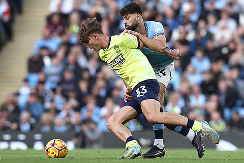 EPL 2024-25: Southampton's Tyler Dibling, front, duels for the ball with Manchester City's Josko Gvardiol