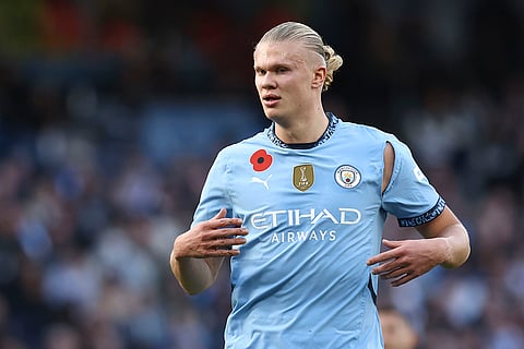 EPL 2024-25: Manchester City's Erling Haaland runs with a ripped shirt