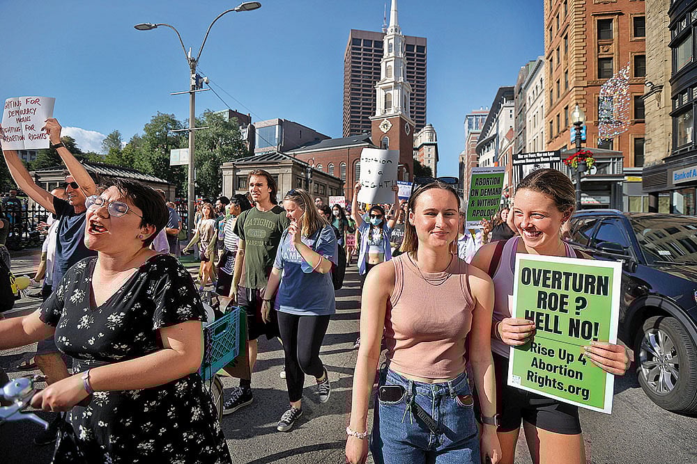 Photo: Getty Images : Protest March: Hundreds of demonstrators march down Tremont street in Boston after the Supreme Court’s decision on Roe v. Wade in June 2022