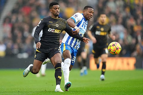 EPL 2024-25: Brighton's Pervis Estupinan, right and Wolverhampton Wanderers' Nelson Semedo vie for the ball