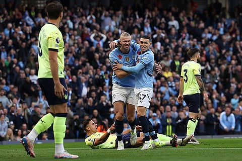 EPL 2024-25: Manchester City's Erling Haaland, center left, celebrates with Phil Foden after scoring his side's opening goal