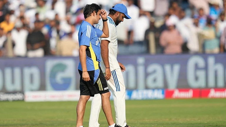 India head coach Gautam Gambhir and captain Rohit Sharma react after their loss to New Zealand in the second Test in Pune. - AP/Rafiq Maqbool