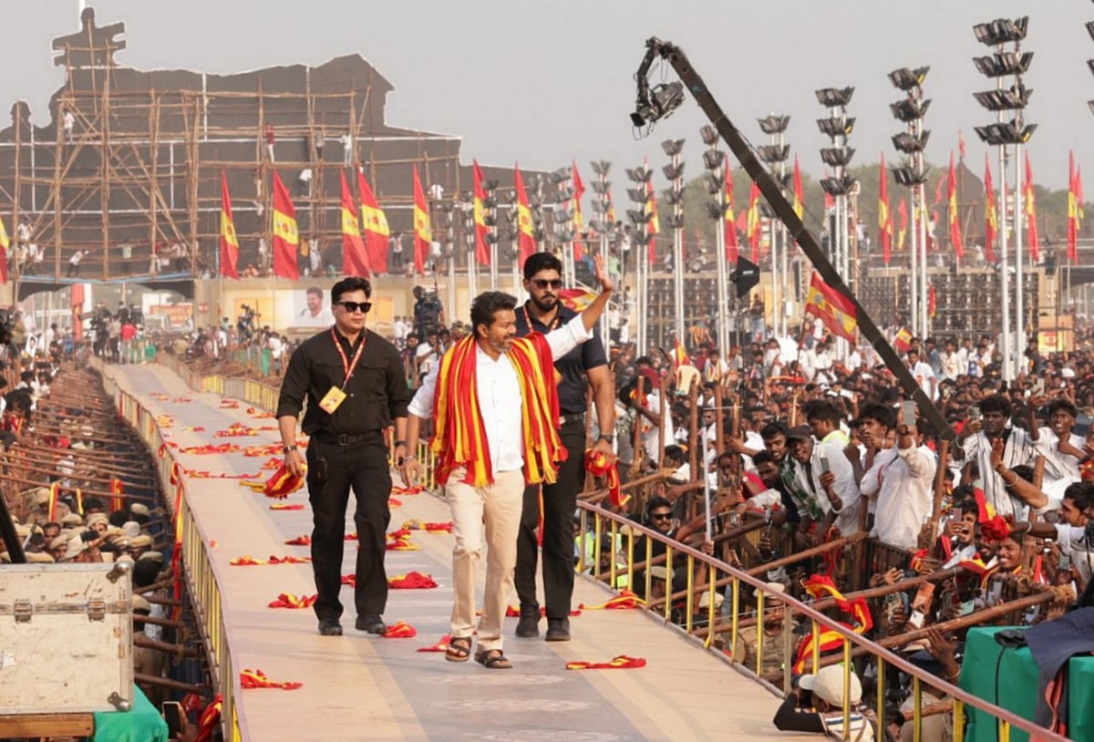 Photo Credit: PTI  : Villupuram: Actor and founder of TVK, Vijay waves at supporters during his first political conference, at Vikravandi.