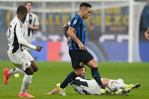 Serie A 2024-25: Inter Milan's Lautaro Martinez is tackled by Juventus' Manuel Locatelli