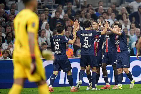 Ligue 1 Soccer 2024-25: PSG players celebrate after Marseille's Leonardo Balerdi unintentionally scored against his team