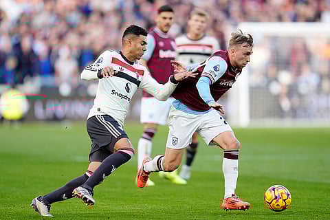 Premier League 2024-25: West Ham United's Jarrod Bowen, right, and Manchester United's Casemiro battle for the ball
