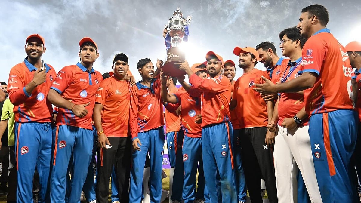 Special Arrangement : The Ghaziabad Bhawani Tigers players pose with the trophy.