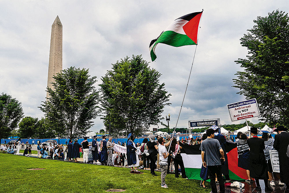 Photo: Getty Images : Demanding Change: Students who walked out from their graduation ceremony gather outside George Washington University on May 19, 2024.