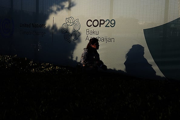 Getty Images : Young girl walks along a fence near the Baku Olympic Stadium