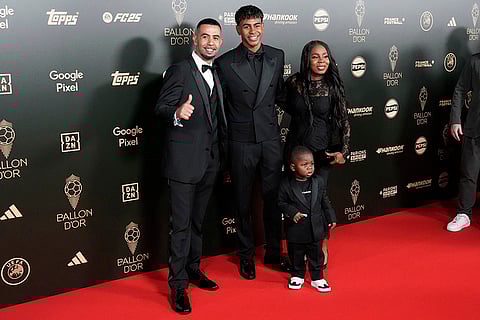 2024 Ballon d' Or Awards: Lamine Yamal, center, his father Mounir Nasraoui, his mother Sheila Ebana, right, and his younger brother Keyne