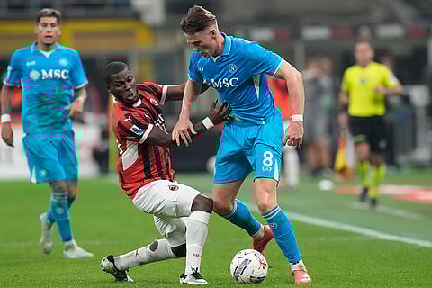 Serie A 2024-25: Napoli's Scott McTominay, right, challenges for the ball with AC Milan's Yunus Musah