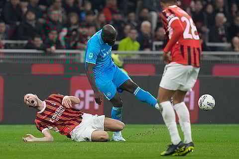 Serie A 2024-25: Napoli's Romelu Lukaku, centre, challenges for the ball with AC Milan's Strahinja Pavlovic