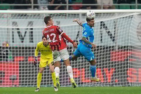 Serie A 2024-25: Napoli's Giovanni Di Lorenzo, right, heads the ball ahead of AC Milan's Filippo Terracciano