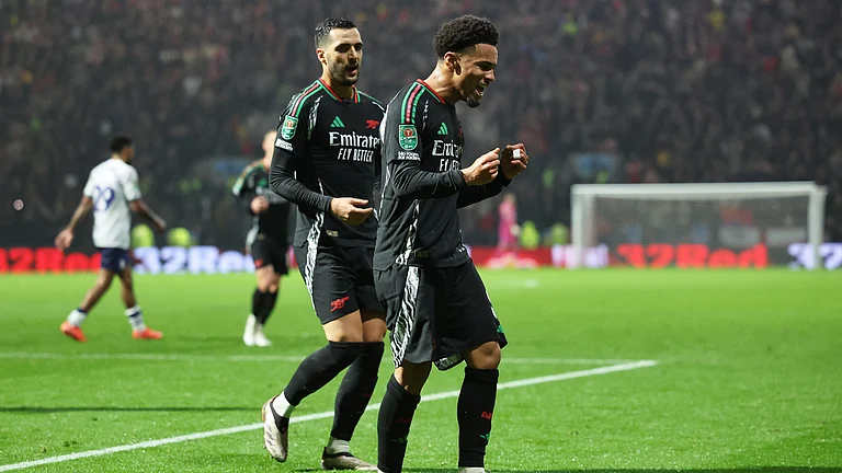 Ethan Nwaneri celebrates his stunning finish at Deepdale - null