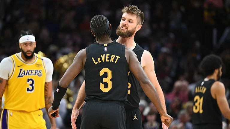 Caris LeVert #3 celebrates with Dean Wade #32 of the Cleveland Cavaliers during the third quarter during the third quarter against the Los Angeles Lakers at Rocket Mortgage Fieldhouse on October 30, 2024 in Cleveland, Ohio. The Cavaliers defeated the Lakers 134-110. - null