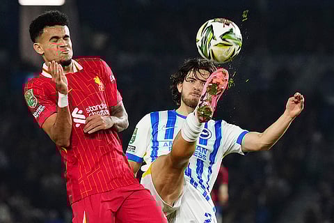 EFL Cup Quarter-Finals: Brighton's Ferdi Kadıoglu, right, kicks the ball by Liverpool's Luis Diaz