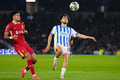 EFL Cup Quarter-Finals: Brighton's Ferdi Kadıoglu, right, controls the ball by Liverpool's Luis Diaz