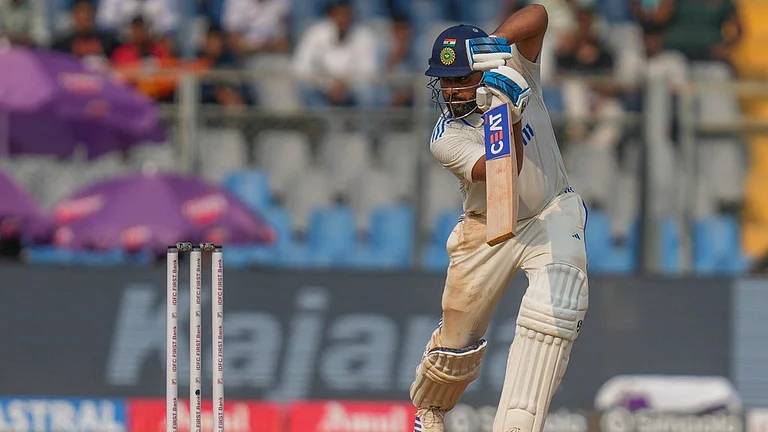 Rohit Sharma plays a shot during the first day of the third cricket test match between India and New Zealand at Wankhede Stadium. - AP
