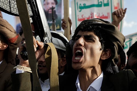 A Houthi supporter shouts slogans in Sanaa