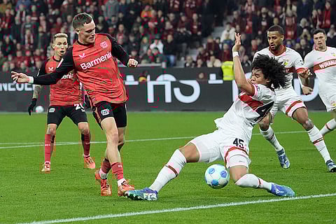 Bundesliga soccer 2024-25: Leverkusen's Florian Wirtz challenges for the ball with Stuttgart's Anrie Chase