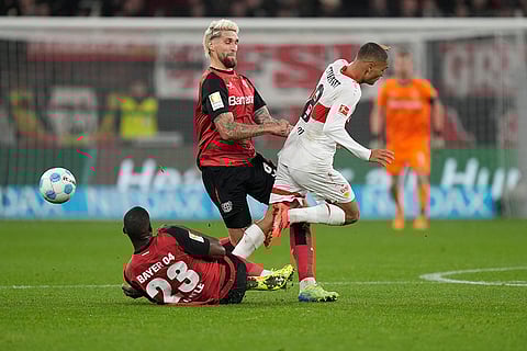 Bundesliga soccer 2024-25: Stuttgart's Enzo Millot, right, challenges for the ball with Leverkusen's Robert Andrich