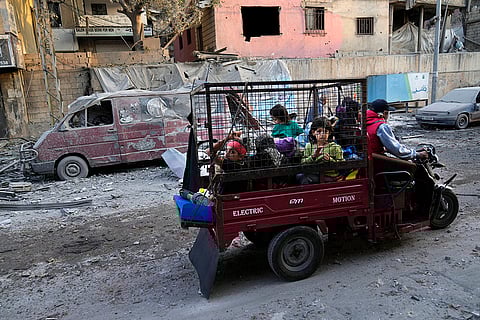 A man rides with his family in Beirut