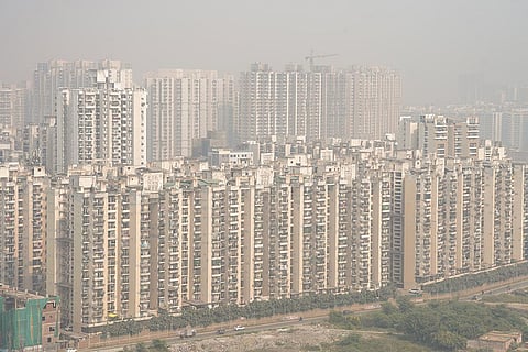 High-rise buildings engulfed in a layer of smog