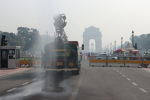 Water spray to curb pollution