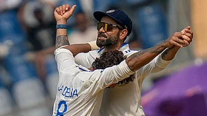 AP : Virat Kohli and Ravindra jadeja in action during the third Test between India and New Zealand in Mumbai.
