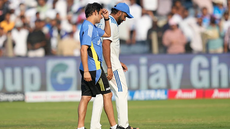 India's head coach Gautam Gambhir, left, and India's captain Rohit Sharma react after their loss against New Zealand on day three of the second cricket test match at the Maharashtra Cricket Association Stadium, in Pune. - AP Photo/Rafiq Maqbool