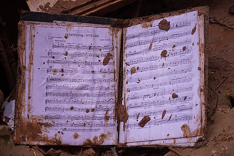 Spain Floods: A music book sits in the mud near Valencia