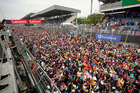 Brazilian Grand Prix 2024: Fans crowd the track during the podium ceremony