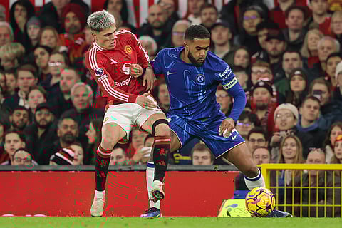 EPL 2024-25: Chelsea's Reece James, right, is challenged by Manchester United's Rasmus Hojlund