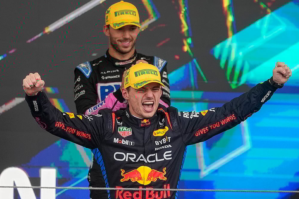 | Photo: AP/Andre Penner : Brazilian Grand Prix 2024: Red Bull driver Max Verstappen, of the Netherlands, celebrates on the podium