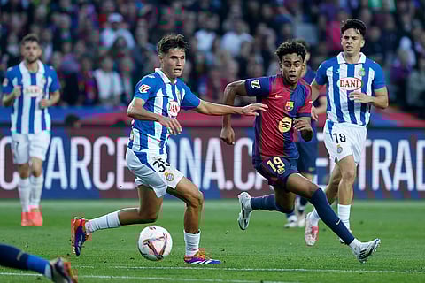 La Liga 2024-25: Barcelona's Lamine Yamal, centre right, challenges for the ball with Espanyol's Rafael Bauza