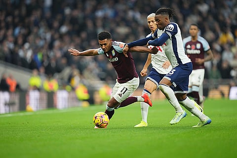 EPL 2024-25: Aston Villa's Ollie Watkins, left, and Tottenham's Destiny Udogie challenge for the ball