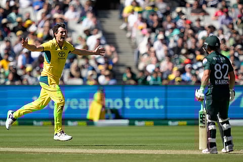 Australia Vs Pakistan, 1st ODI: Pat Cummins, left, celebrates after taking the wicket of Pakistan's Kamran Ghulam