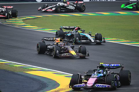 Brazilian Grand Prix 2024: Red Bull driver Max Verstappen of the Netherlands, center, steers his car