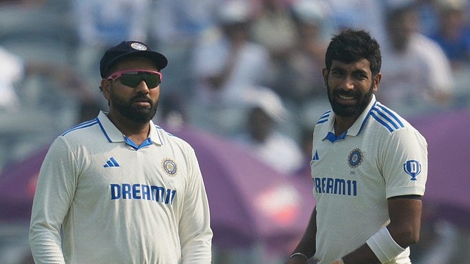 AP/Rafiq Maqbool : Jasprit Bumrah and Rohit Sharma.