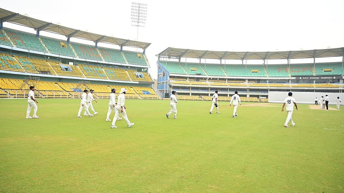 X/assamcric : Cricketers walking onto the field during a Ranji Trophy game.