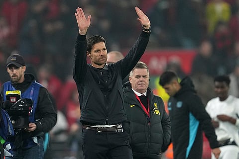 Champions League 2024-25: Leverkusen's head coach Xabi Alonso waves to the crowd at the end of the match