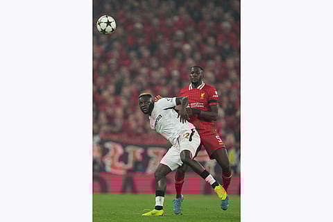 Champions League 2024-25: Leverkusen's Victor Boniface, left, is challenged by Liverpool's Ibrahima Konate
