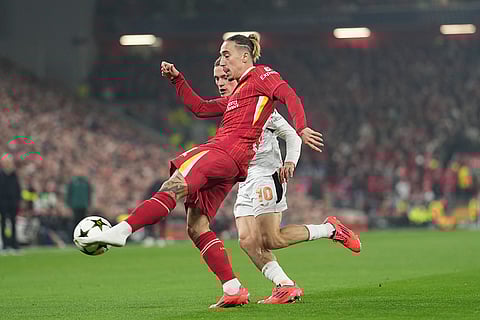 Champions League 2024-25: Leverkusen's Florian Wirtz, rear, chases Liverpool's Kostas Tsimikas