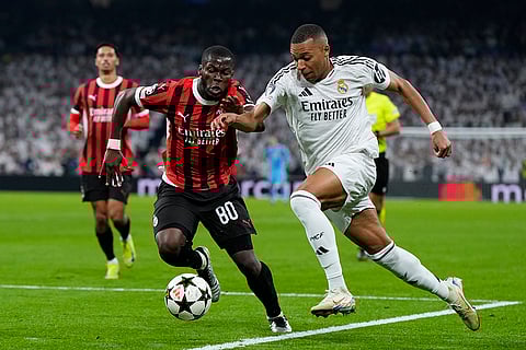 Champions League 2024-25: Real Madrid's Kylian Mbappe, right, and AC Milan's Yunus Musah battle for the ball