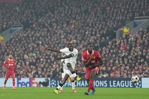 Champions League 2024-25: Leverkusen's Victor Boniface, left, takes a shot