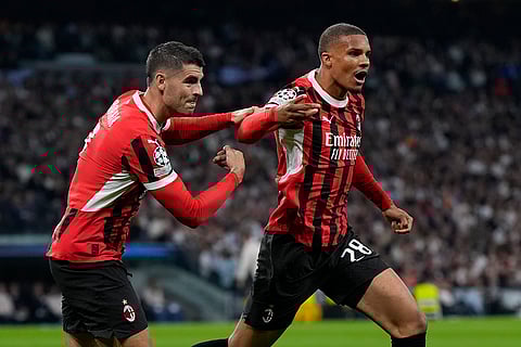 Champions League 2024-25: AC Milan's Malick Thiaw, right, celebrates with Alvaro Morata after scoring the opening goal
