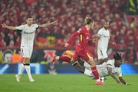 Champions League 2024-25: Liverpool's Kostas Tsimikas challenges Leverkusen's Jeremie Frimpong