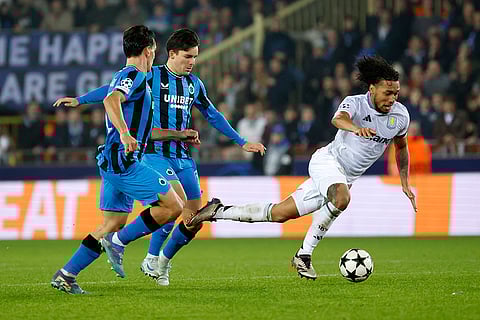 UEFA Champions League: Brugge's Ardon Jashari, left, and Hugo Vetlesen, center, defend against Aston Villa's Boubacar Kamara