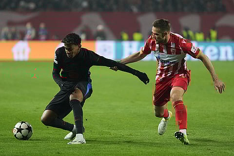 UEFA Champions League: Red Star's Timi Max Elsnik, right, and Barcelona's Lamine Yamal fight for the ball